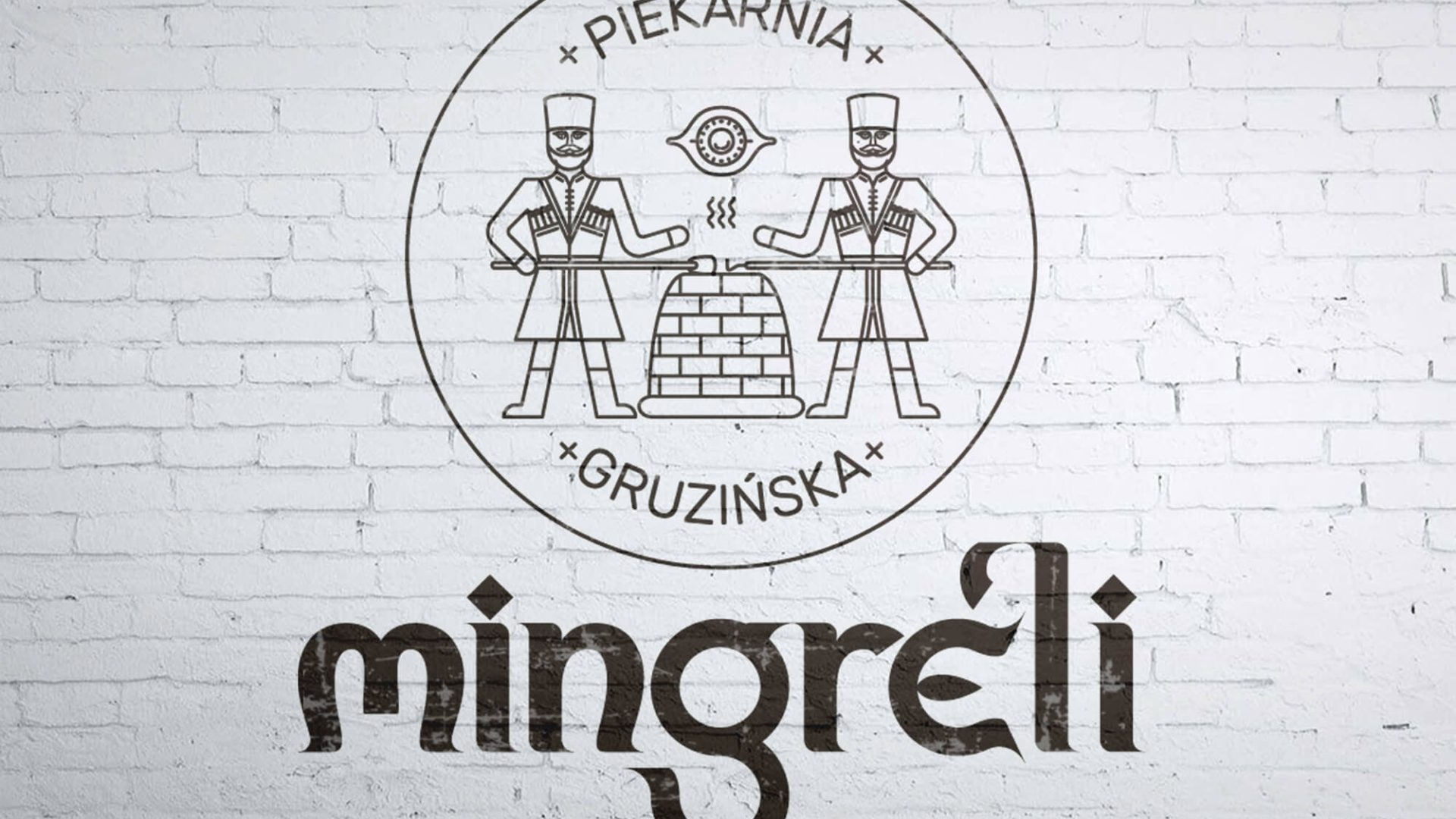 MINGRELI Piekarnia Gruzińska - logo mur biała cegła